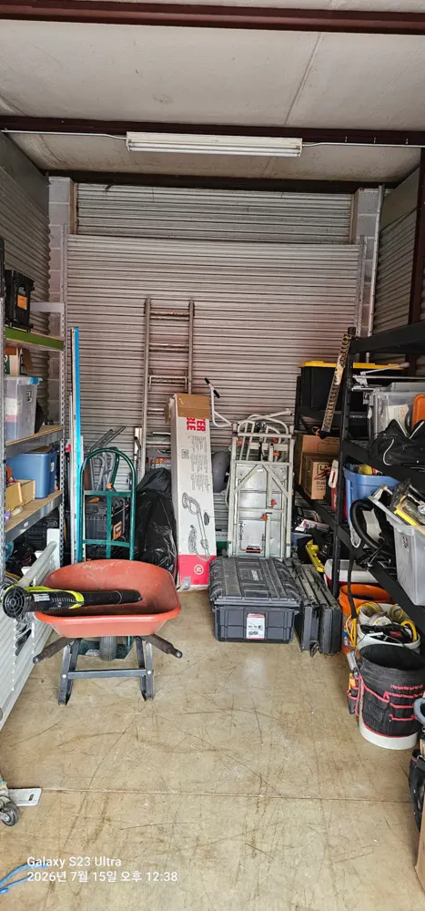 Storage unit full of tools and equipment before cleanout