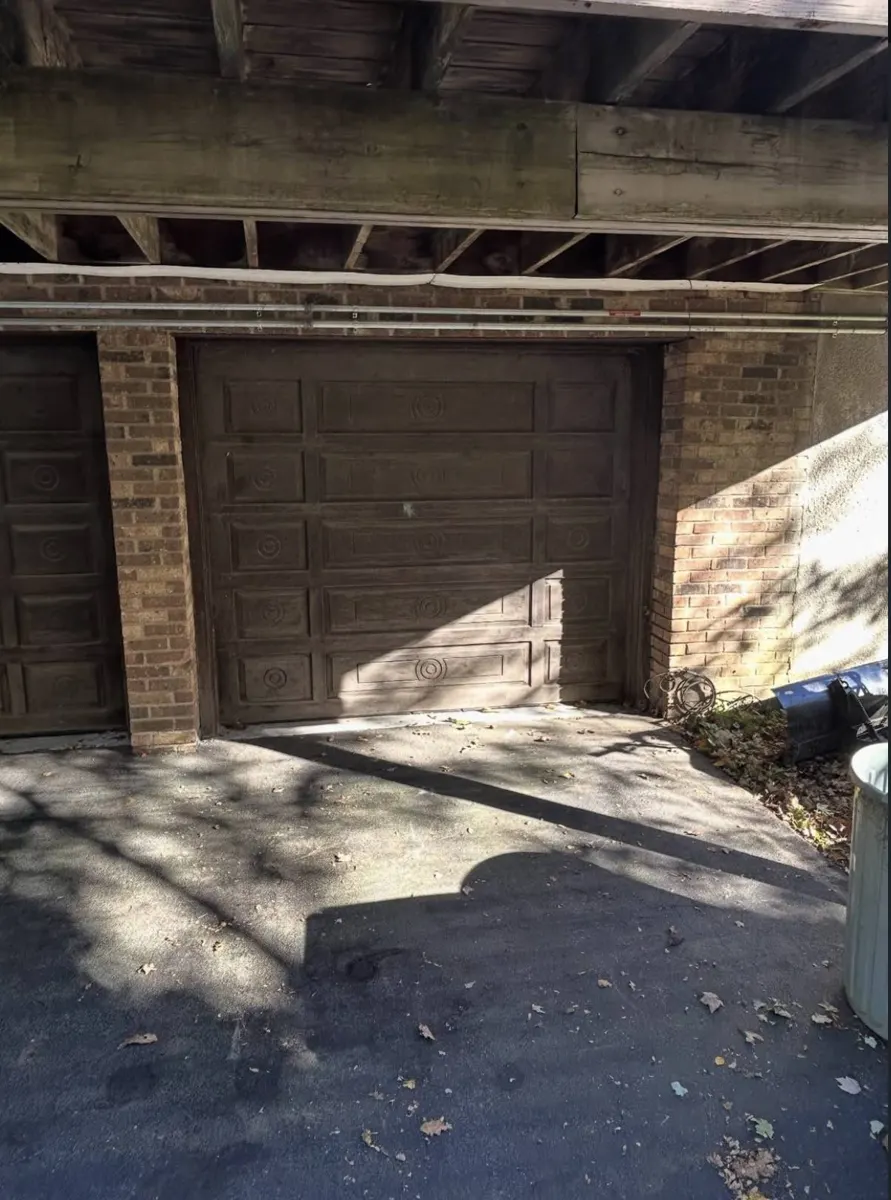 Dresser, stone table, pipes and hoses piled in a driveway — after
