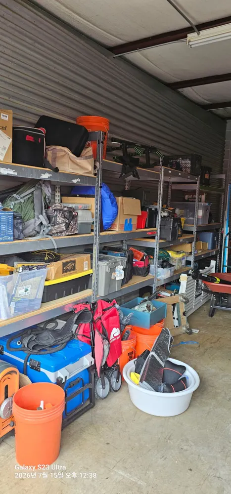 Packed storage unit shelves before junk removal