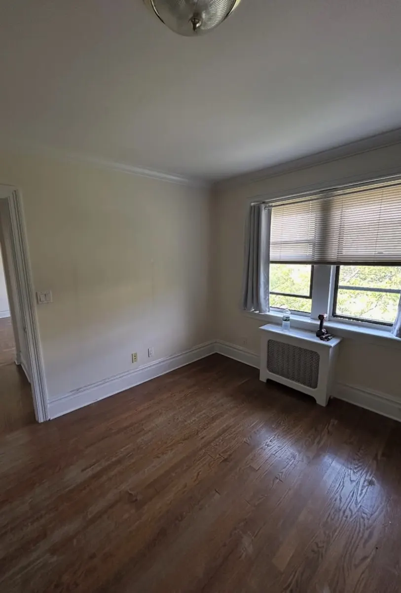 Bedroom with dresser, mirror and furniture before removal — after