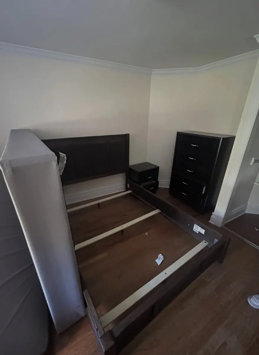 Bed frame, box spring, nightstand and chest before removal