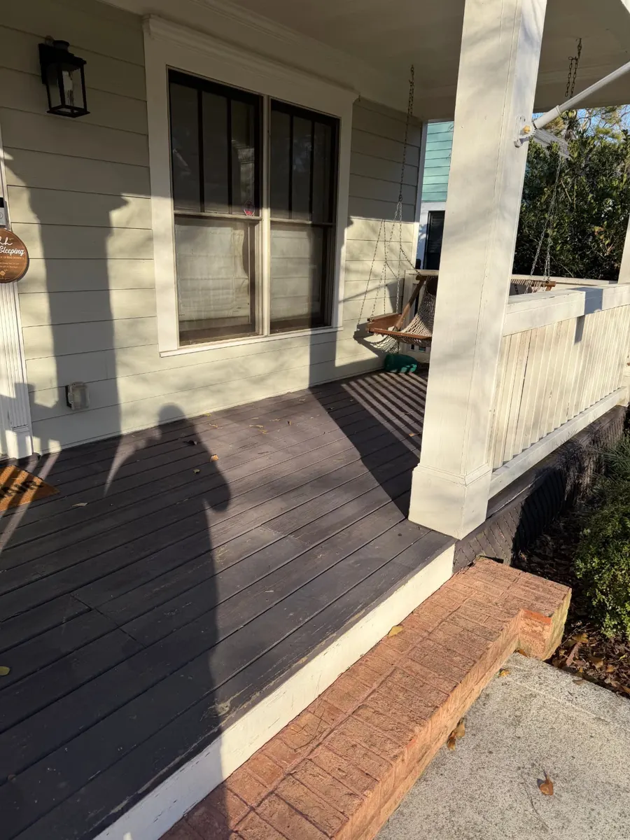 Mattress, box spring and boxes on a front porch before pickup — after